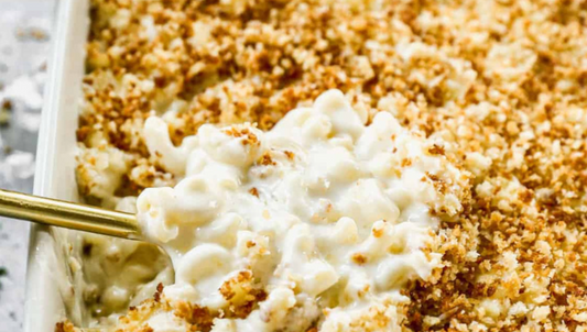 Spoonful of Macaroni N Cheese in Baking Dish