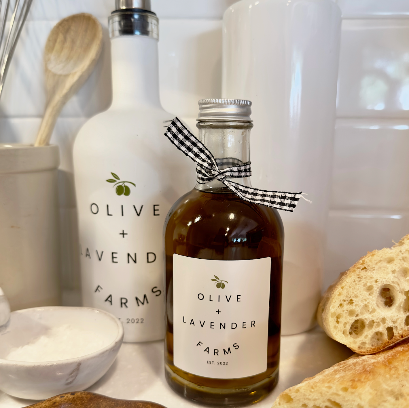 Bottle of Olive + Lavender Farms Olive Oil on a kitchen counter.