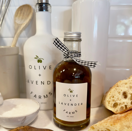 Bottle of Olive + Lavender Farms Olive Oil on a kitchen counter.