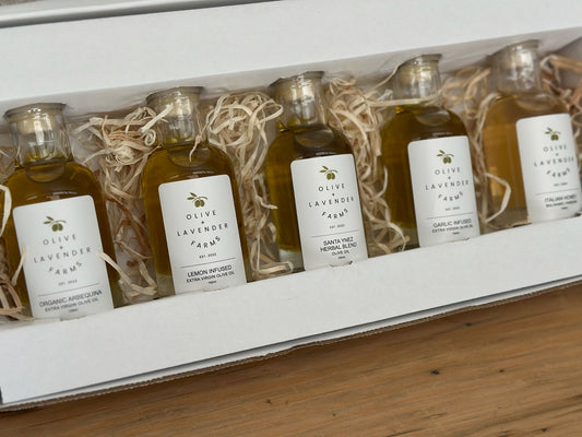 Row of small bottles with labels on a wooden surface